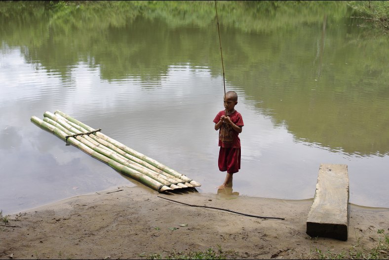 CHILD BY THE RIVER